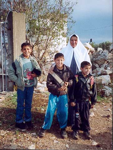 The family who have been cut off from the village by the fence.